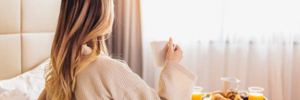 Breakfast in bed, cozy hotel room. concept