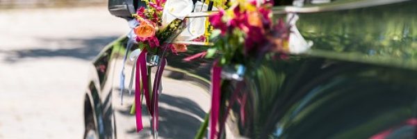 Wedding bouquet on new wedding car!