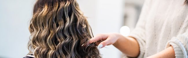 Hair stylist dooing a hair care treatment for client